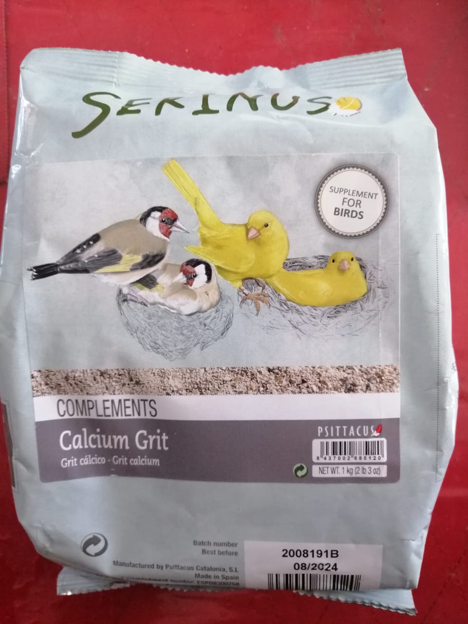 Serinus Calcium grit en canasta en casa